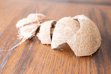 Cracked Coconut shell pieces on a table
