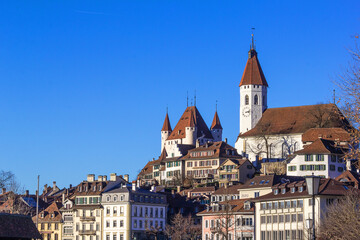 The famous Thun town with medieval castle under blue sunny sky, Canton Bern, Switzerland