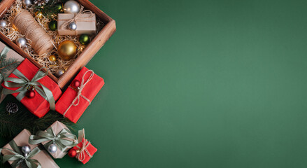 New Year banner with Christmas gift boxes and decorations on khaki background.