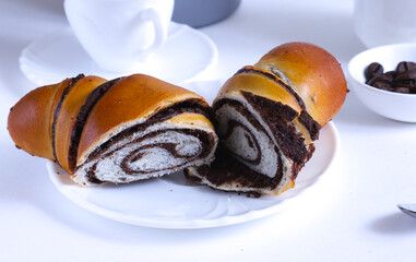 Large cross-sectional croissant with chocolate striped filling. Shallow depth of field