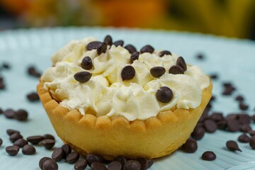 Closeup of a mini Banoffee pie sprinkled with chocolate chips