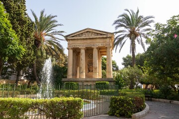 Fototapeta na wymiar Lower Barakka Gardens with the Monument to Sir Alexander Ball in Valletta, Malta