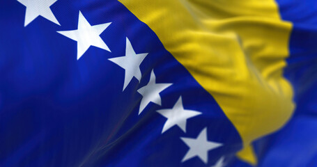 Close-up view of Bosnia and Herzegovina flag waving in the wind