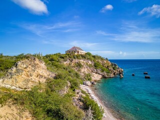Aerial shot of the scenic Caracas Bay in Willemstad Curacao with blue seawater and skyscape