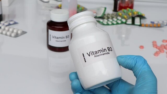 Vitamin B3 pills in a bottle, food supplement for health or used to treat disease