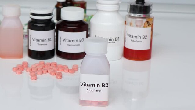 Vitamin B2 pills in a bottle, food supplement for health or used to treat disease