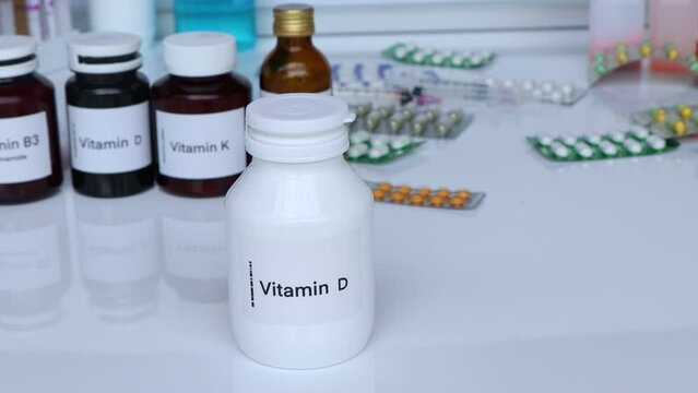 Vitamin D pills in a bottle, food supplement for health or used to treat disease