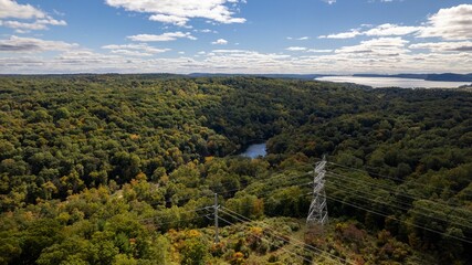 Drone shot of the Old Croton Trailway State Park on a sunny day in autumn with cloudy sky © Audley C Bullock/Wirestock Creators