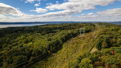Drone shot of the Old Croton Trailway State Park on a sunny day in autumn with cloudy sky © Audley C Bullock/Wirestock Creators
