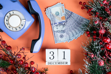 December 31 New Year, money for a gift and an old phone. christmas decor