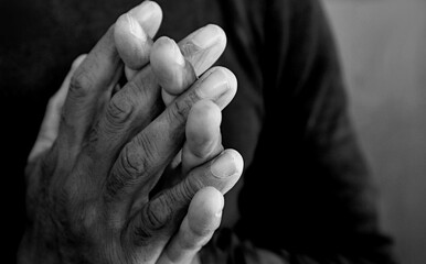people praying to God with hands together stock photo