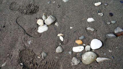 Fototapeta na wymiar stones in the sand