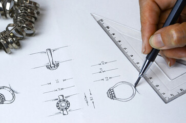 Jewelry design drawing On paper, draw a detailed diamond ring jewelry sketch on the top and side of...
