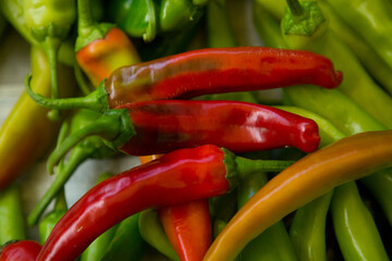 Hot chili pepper background. Red and green peppercorns as a background. Healthy food concept.