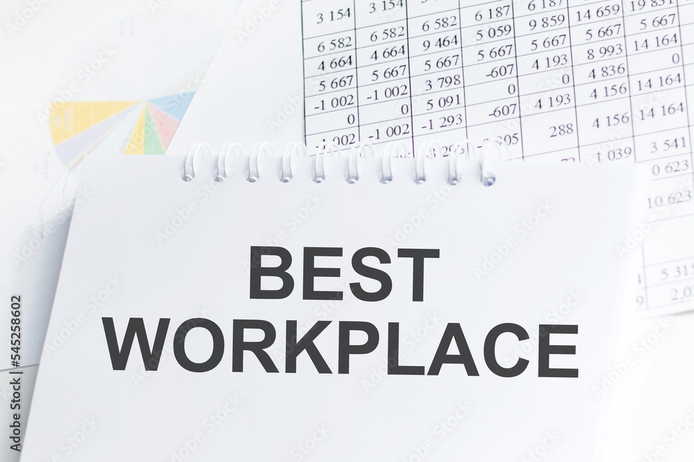 Poster best workplace text concept write on a notebook on the table with documents, business concept