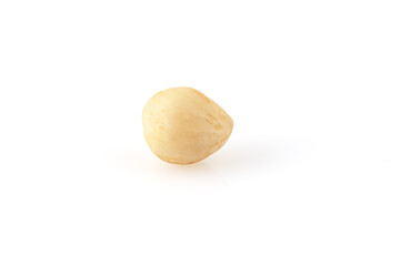 Peeled hazelnuts isolated on white background. Fried hazelnut without shell. Full depth of field. Close-up