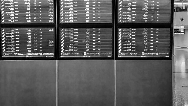 Doha, Qatar - December 3, 2016: Flight information screen at Hamad International Airport