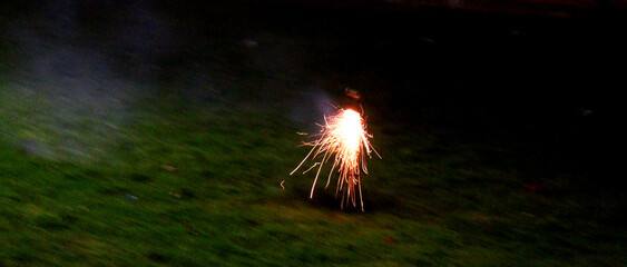 Burning fuse on fireworks just being lit at New Years Eve 