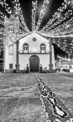 Madeira, Portugal - September 4, 2022: Garlands, street decorations at Madeira Wine Festival at night in Ponta Delgada