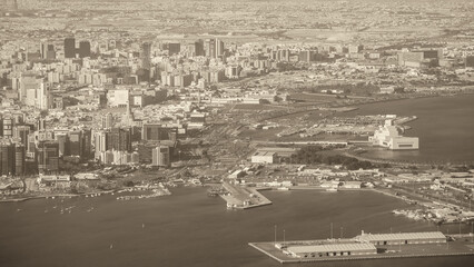 Doha, Qatar. Aerial view of city skyline from a flying airplane over the Qatar capital