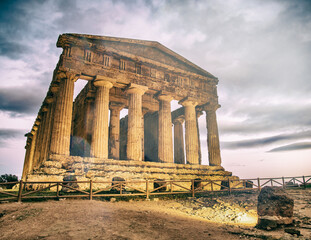 Temple of Concordia in the Valley of the Temples at sunset in Agrigento - Sicily, Italy.