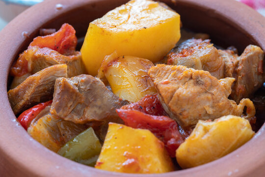Top view of Turkish food Guvec - meat with vegetables in the oven and traditionally served in a pot (Turkish name; guvec with meat and vegetables)