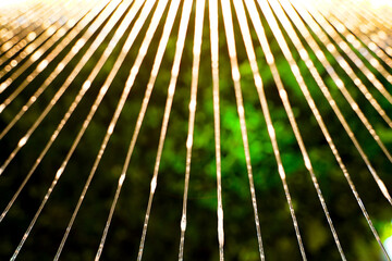 Abstract yellow lines of bokeh water flowing pattern with green background.