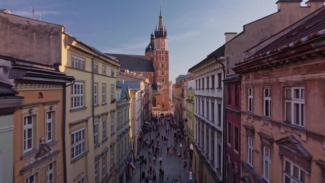 Aerial view of Floriańska Street in Cracow, Old Town, Poland. Flying over Main Market Square (Rynek Gł&oacute;wny w Krakowie), Saint Mary's Basilica (kości&oacute;ł Mariacki) and  Sukiennice