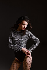 Professional model in zebra shirt poses for looking in camera