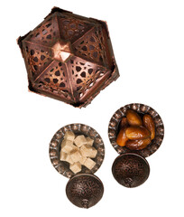 Arabic lantern and plate with date fruits on the table