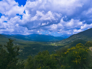 Fototapeta na wymiar Kefalonia landscape, village in the background, cloudy day in Greece 