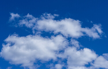 Blue sky and white clouds background.