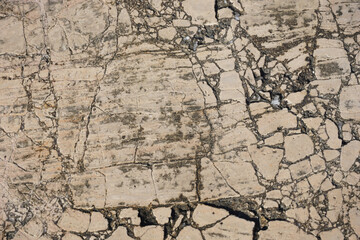 cracked beige rock surface structure