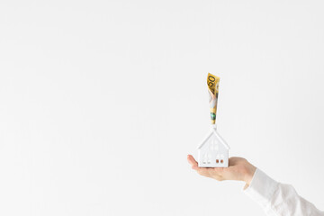 Australian fifty 50 dollars note currency woman holding model house home