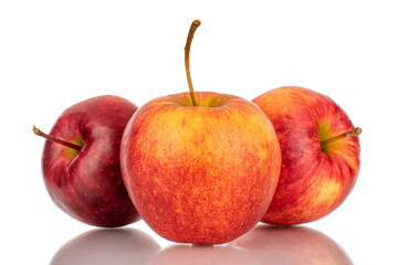 Three red ripe apples, macro, isolated on white background.