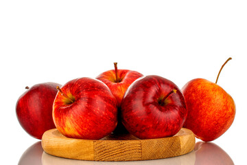 Several red ripe apples on a wooden plate, macro, isolated on white background.