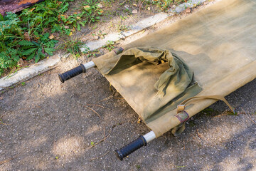 Military field stretcher element with selective focus. Background