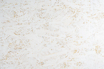 Oriented strand board OSB painted white. Background of rough surface made of compressed sawdust. Construction backdrop