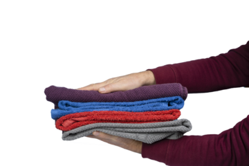 a man holds some towels in his hands
