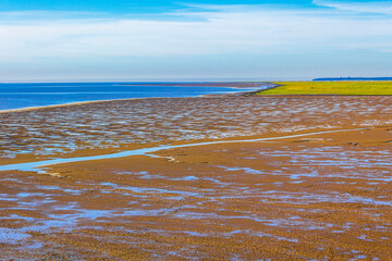 Beautiful coast mudflats and wadden sea seascape landscape Dorum Germany.