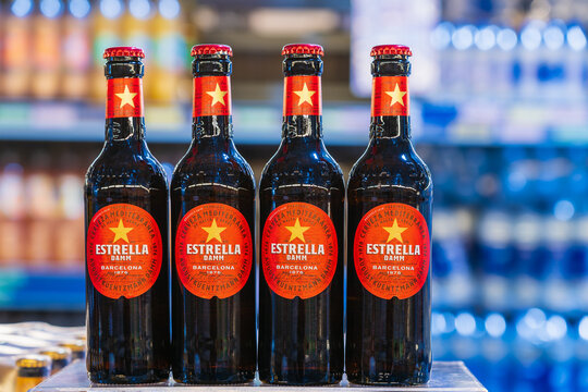Beer Estrella Damm in glass bottles. Goods in the supermarket. June 15, 2022 Balti Moldova.