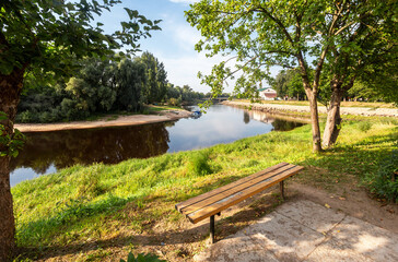 Fototapeta na wymiar View of the calm current of the Polist River in the provincial city of Staraya Russa, Russia