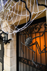 Giant spider and web as outdoor Halloween decorations.