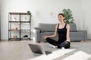 Fototapeta na wymiar Woman meditating at home