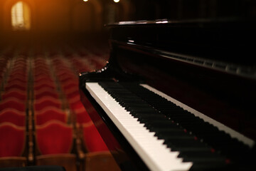 piano on stage in an empty concert hall view from the stage - obrazy, fototapety, plakaty