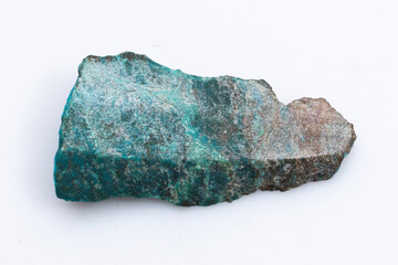 Natural Chrysocolla stone on a white background. Mineral of blue and bluish-green color on a white...