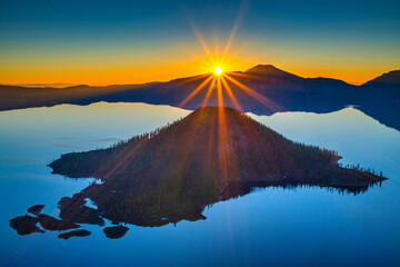 View of sunrise over Crater Lake on a calm summer morning.