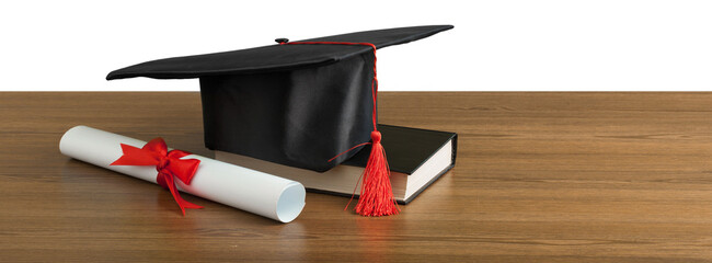 Black graduation hat with diploma and book