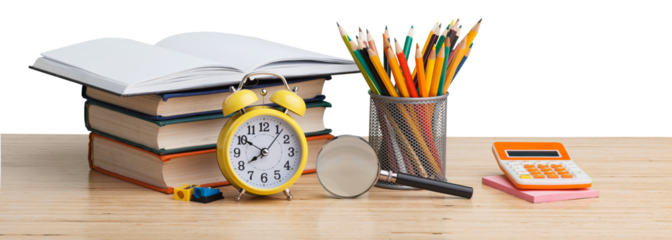 Stacked books with colorful pencils on the desk