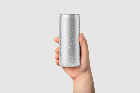 Aluminium drink can 250ml with water drops in a hand mockup template, isolated on light grey background. High resolution.